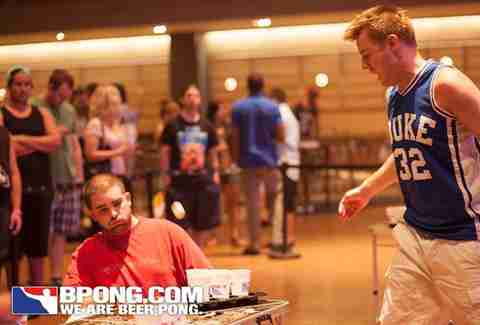 guy throwing in beer pong