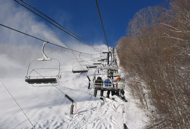 people riding ski lift