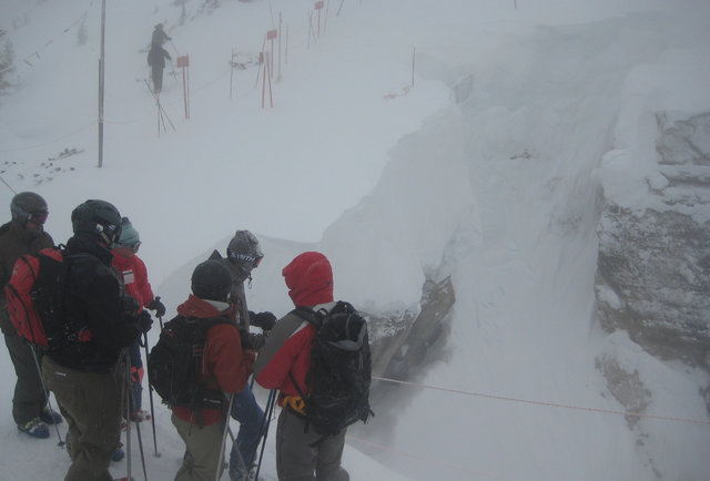 Skiers on the slope in a snowstorm