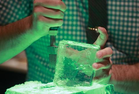 bartender cutting ice