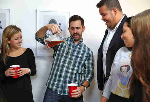 guy pouring a beer from a pitcher