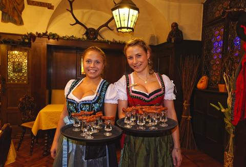 women in dirndls with beer