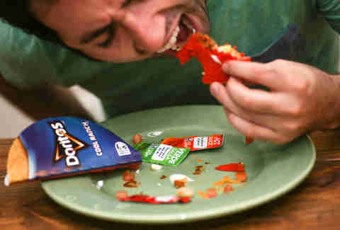 eating a Taco Bell Doritos Loco Taco
