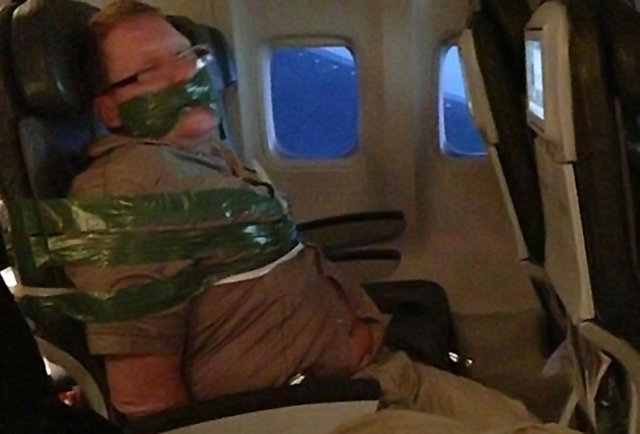 Dude duct taped on plane