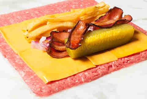Making a cheeseburger bacon burrito