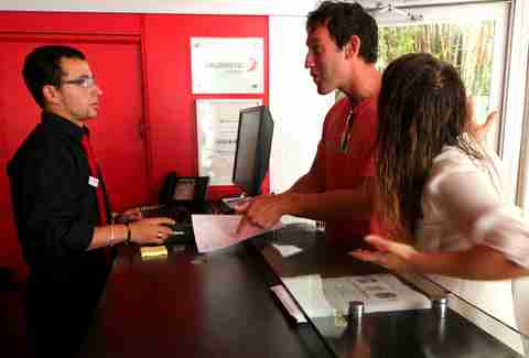 man being belligerent with hotel staff