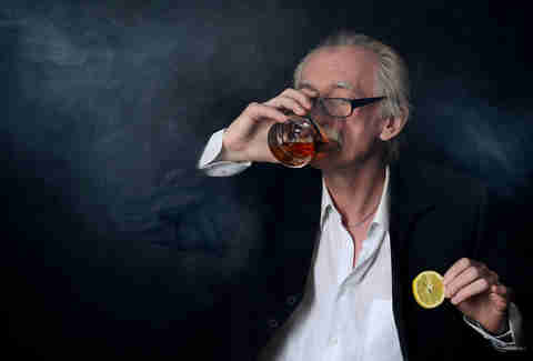 Old man drinking whiskey