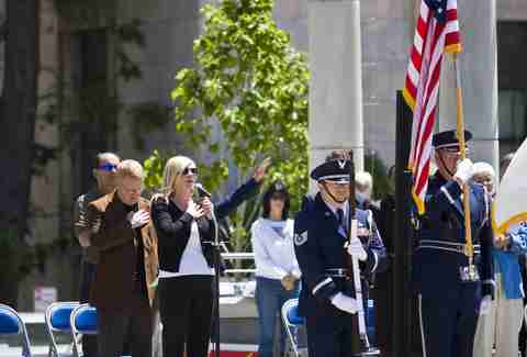 Lady singing national anthem