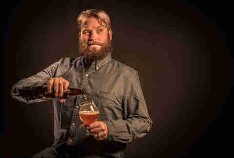 guy pouring beer