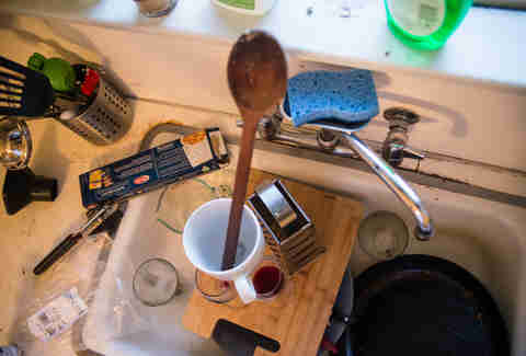 dirty dish tower in sink