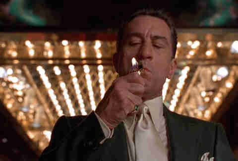 Robert DeNiro lighting a cigarette in Martin Scorsese's Casino