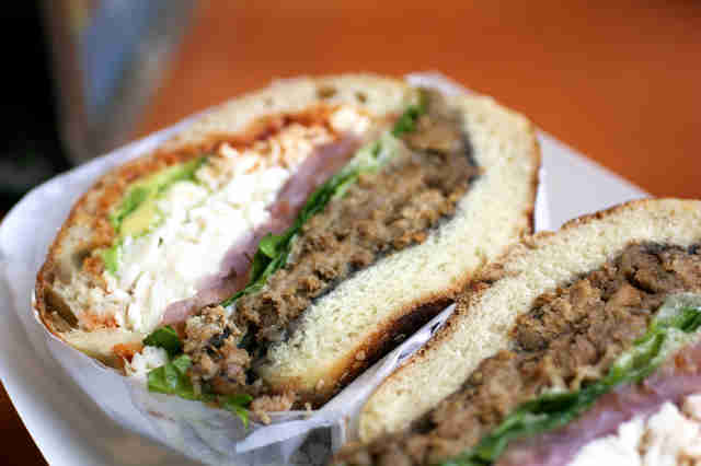 cemita sandwich cut in half with taco meat