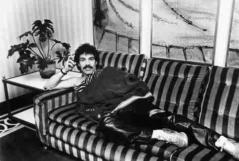 John Oates lounges on sofa in England