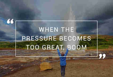 Woman standing in front of geyser