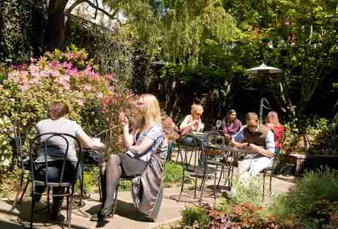 patrons sitting outside at Arlequin Cafe