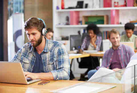 man listening to music at work