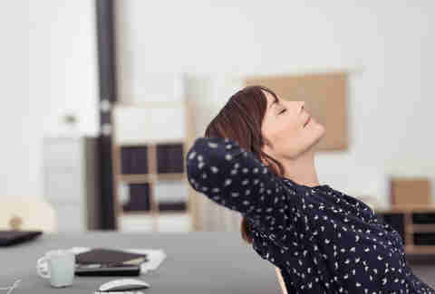 woman relaxing in work office