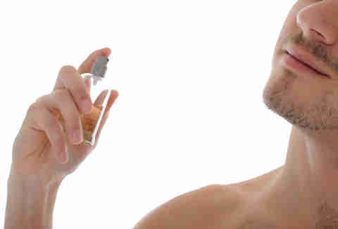 Man spraying cologne