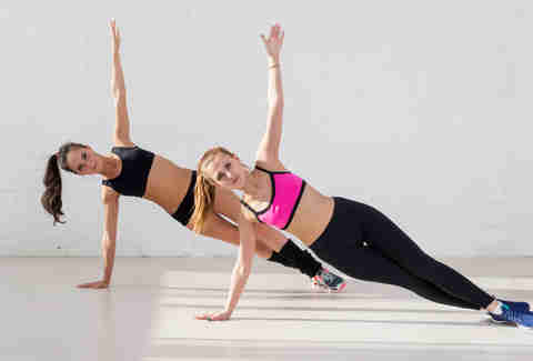 women exercising side plank