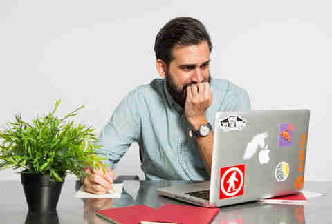 man stressed on computer