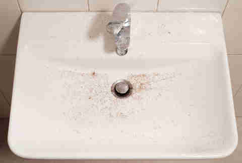 sink with beard hair