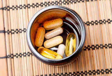 Vitamin pills in a ramekin