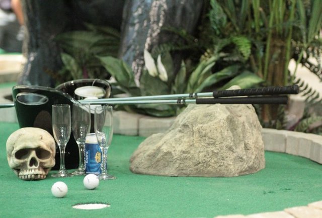 Cans of beer, shuffleboard, beer pong & more