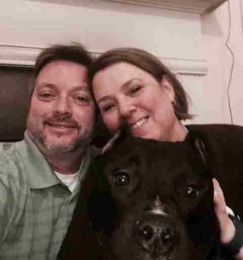 nurse takes care of man's dog