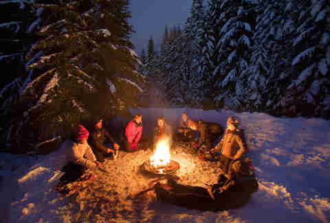 People having a snowshoe bonfire