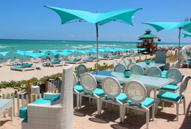 Bottles and lobster tails on the sand
