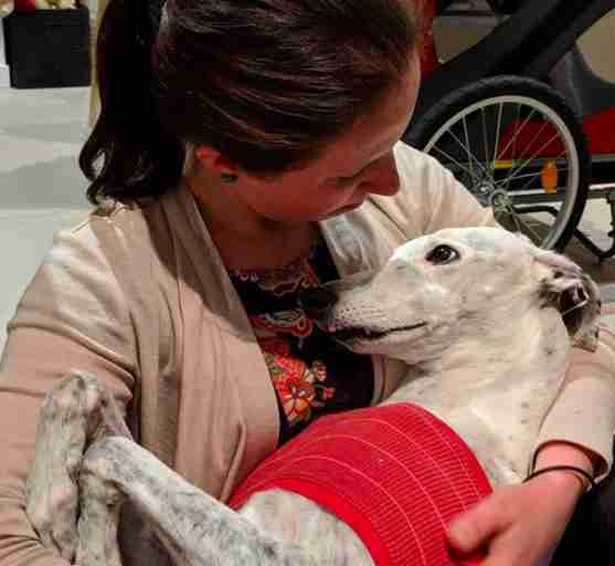 Lucy hugs her dog Salty