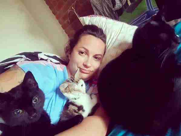 Georgia Anderson snuggling her cats
