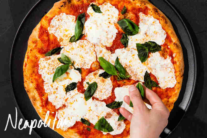 Neapolitan pizza, mozzarella and basil