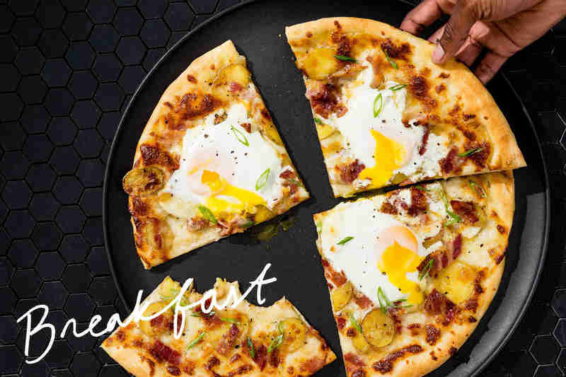 breakfast pizza with eggs and bacon