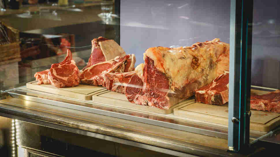 aged steaks in a fridge