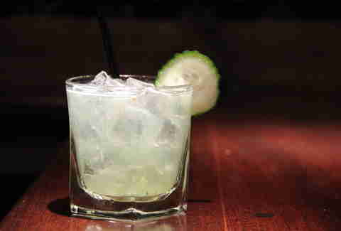 Cocktail with a cucumber garnish