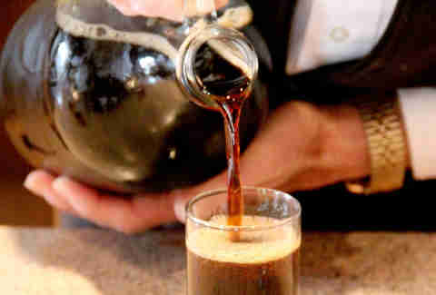 Brewer pouring Kentucky Bourbon Barrel Stout