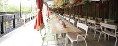 Large-format beers, BBQ, and ping pong on a balcony on the LES