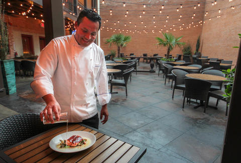 Chef Nico Sanchez pours Tequila at Meso Maya, Dallas TX