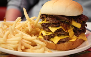 A Thrillist editor taste-tests Steak & Shake's seven-patty, 1330-calorie burger