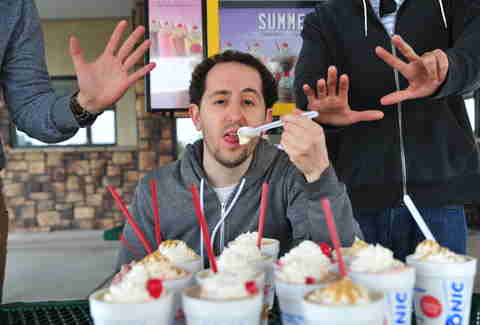guy eats a peanut butter bacon shake at Sonic