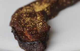 Our ravenous editorial assistant tears through a slab of bacon covered in chocolate and 23-karat gold