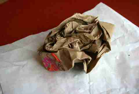 A crumpled Dunkin Donuts bag