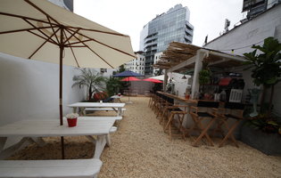 Welcome to Gilligan's, the Soho Grand's outdoor ode to beach, booze & pizza
