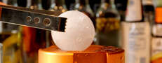 Beer cocktails and giant balls of ice in a Rittenhouse library