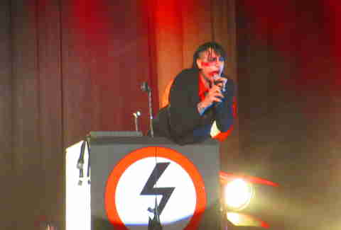 Marilyn Manson behind a podium