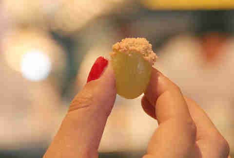 A green grape dipped in foie gras at Stephen Starr's Serpico on South St