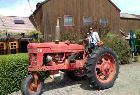 Defne Altan on top of a tractor