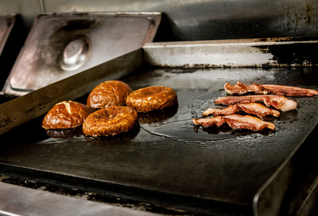 Bacon and buns on the grill at Slater's 50/50 in San Diego.-This 'Merica Burger is basically 100% made of bacon