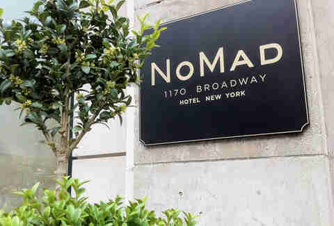 NoMad sign and greenery